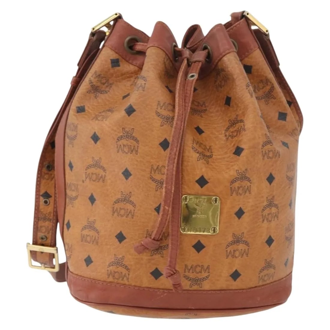 MCM Visetos Brown Canvas Leather Shoulder Bag 22cm x 28cm x 15cm: MCM Visetos Brown Canvas Leather Shoulder Bag 22cm x 28cm x 15cm This MCM Visetos shoulder bag is crafted from brown canvas with leather accents, designed for women. The bag shows signs of use includi