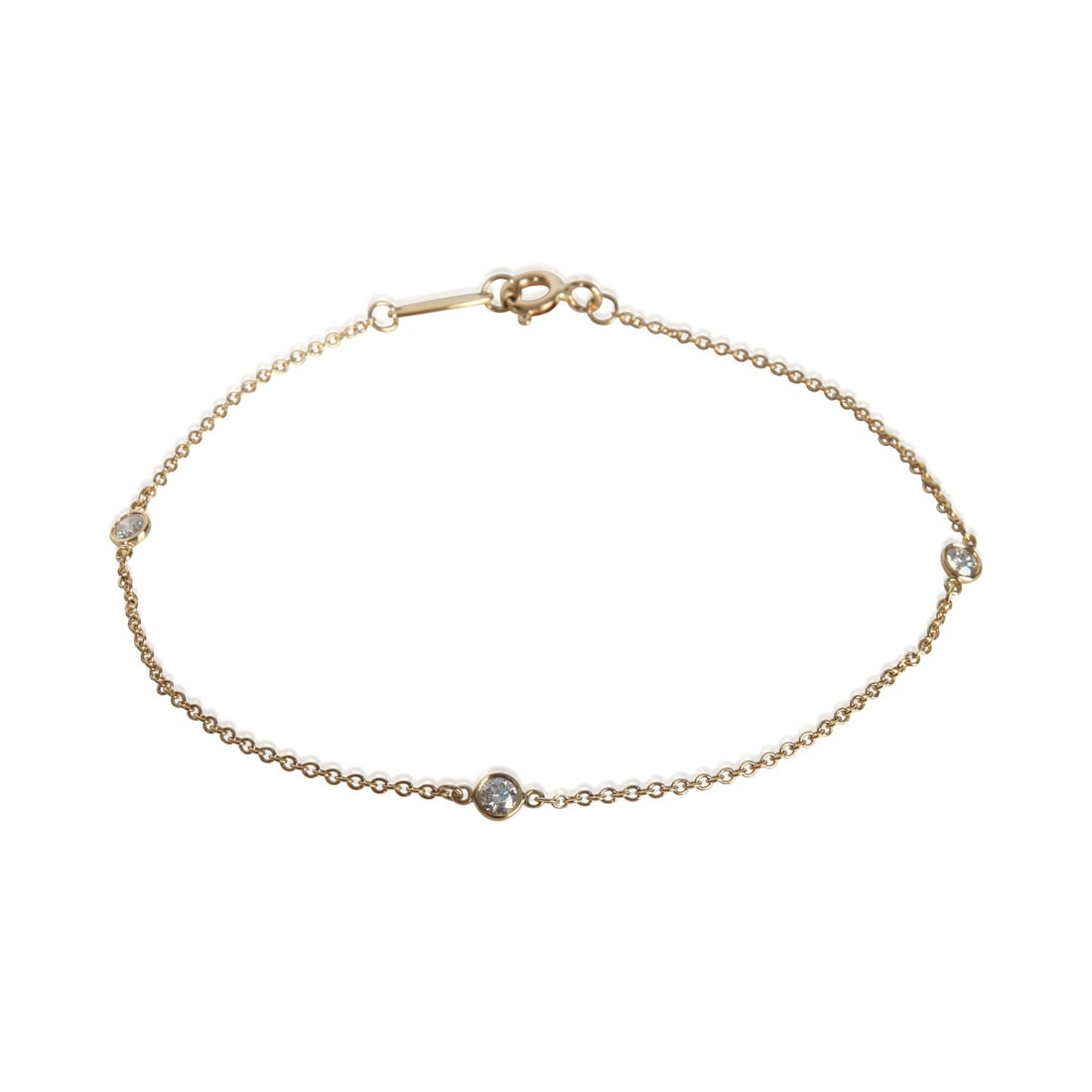 Tiffany & Co. Elsa Peretti Diamond By The Yard 18k Gold Bracelet With Box: Tiffany & Co. Elsa Peretti Diamond By The Yard 18k Gold Bracelet With Box This Tiffany & Co. Elsa Peretti Diamond By The Yard bracelet features three round brilliant diamonds set in 18k yellow gold. T