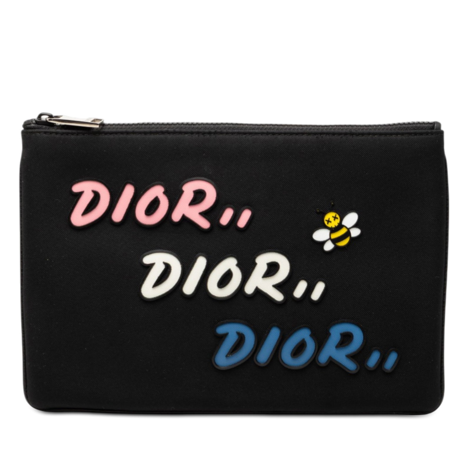 Black Nylon Pouch with Kaws Bee Motif by Dior: Black Nylon Pouch with Kaws Bee Motif by Dior This Dior Kaws Bee pouch is crafted from black nylon and features a top zip closure. The pouch shows wear on the exterior corners, stains on the exterior 