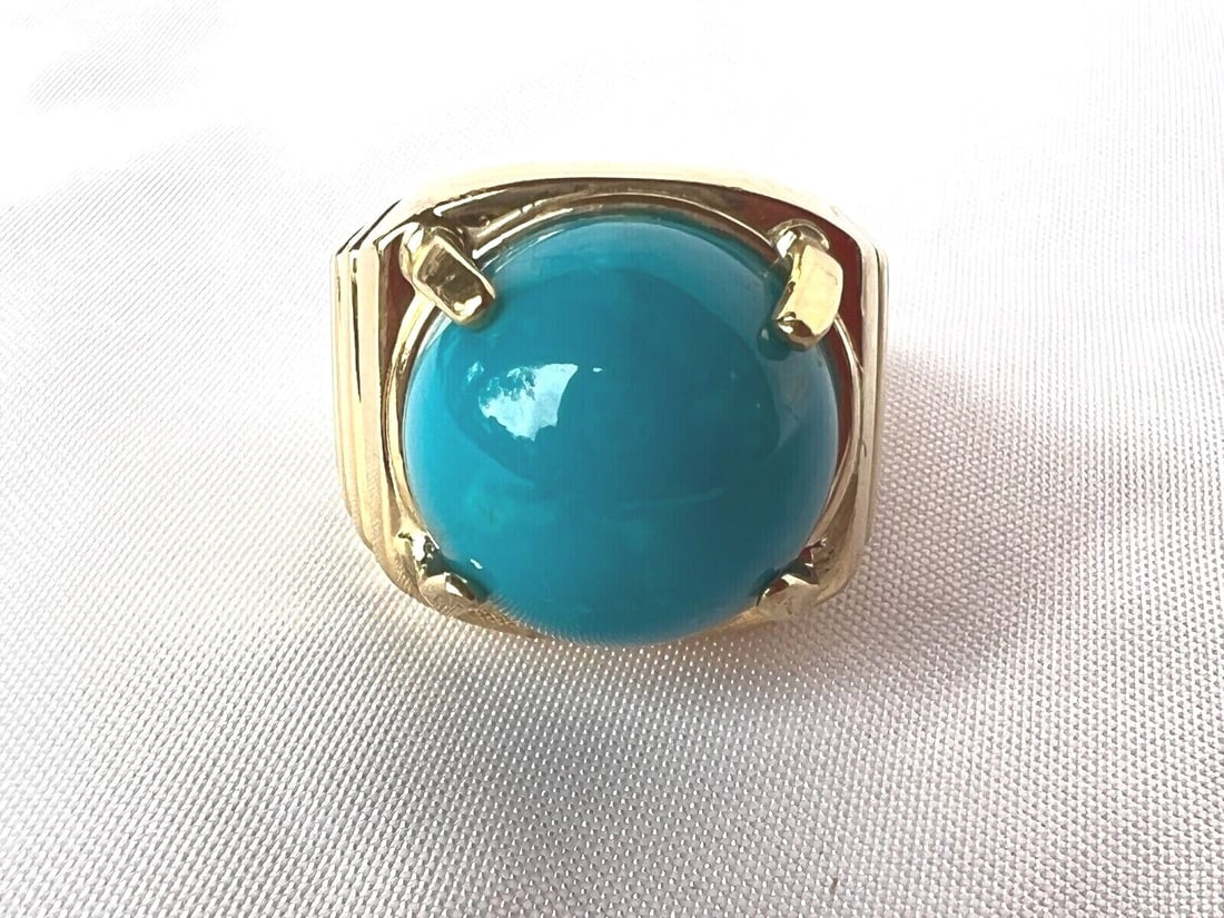 Persian Style 14K Yellow Gold Turquoise Ring Size 12: Persian Style 14K Yellow Gold Turquoise Ring Size 12 This stunning large ring features a vibrant blue turquoise stone, set in exquisite 14K yellow gold. The ring is designed in a Persian style, showca