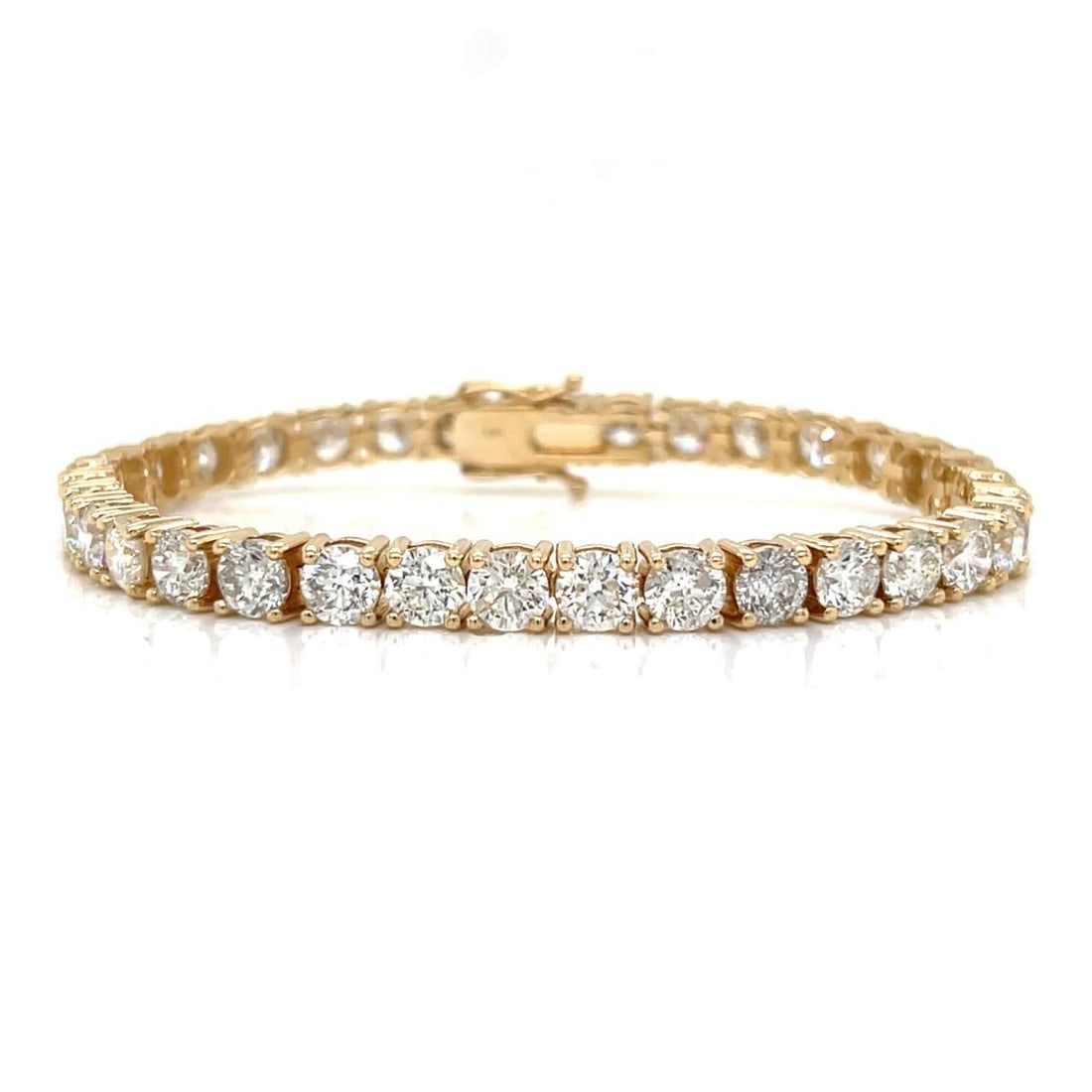 14K Yellow Gold Diamond Tennis Bracelet 16.40 Ct 34 Diamonds I-J SI2-I1: 14K Yellow Gold Diamond Tennis Bracelet 16.40 Ct 34 Diamonds I-J SI2-I1 This stunning 14K Yellow Gold Tennis Bracelet features a remarkable total diamond weight of approximately 16.40 ct. It is adorne