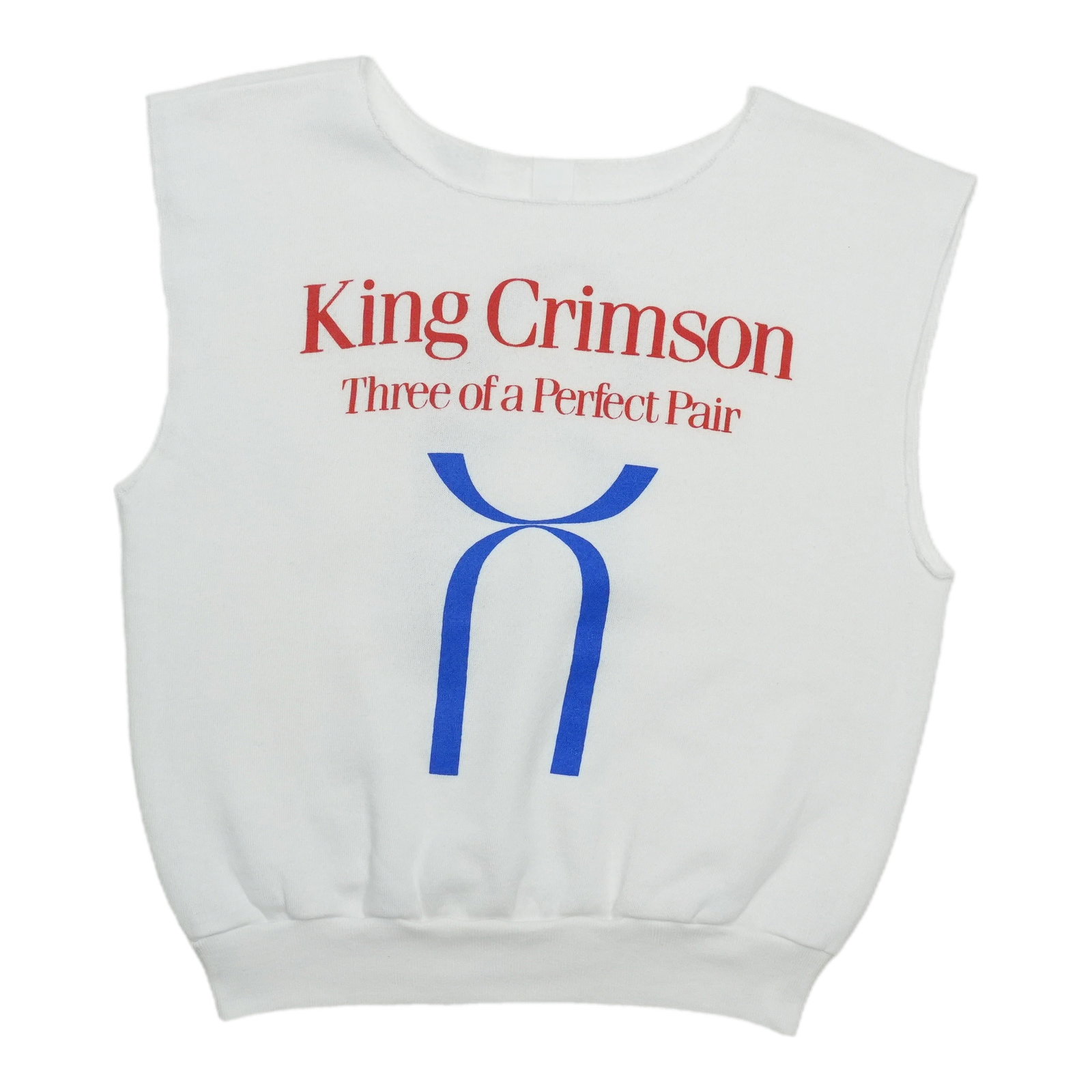 King Crimson 1984 Three Of A Perfect Pair White Sleeveless Shirt: King Crimson 1984 Three Of A Perfect Pair White Sleeveless Shirt This is an original vintage 1984 King Crimson Three Of A Perfect Pair sleeveless shirt. It is not a modern reproduction and features a 