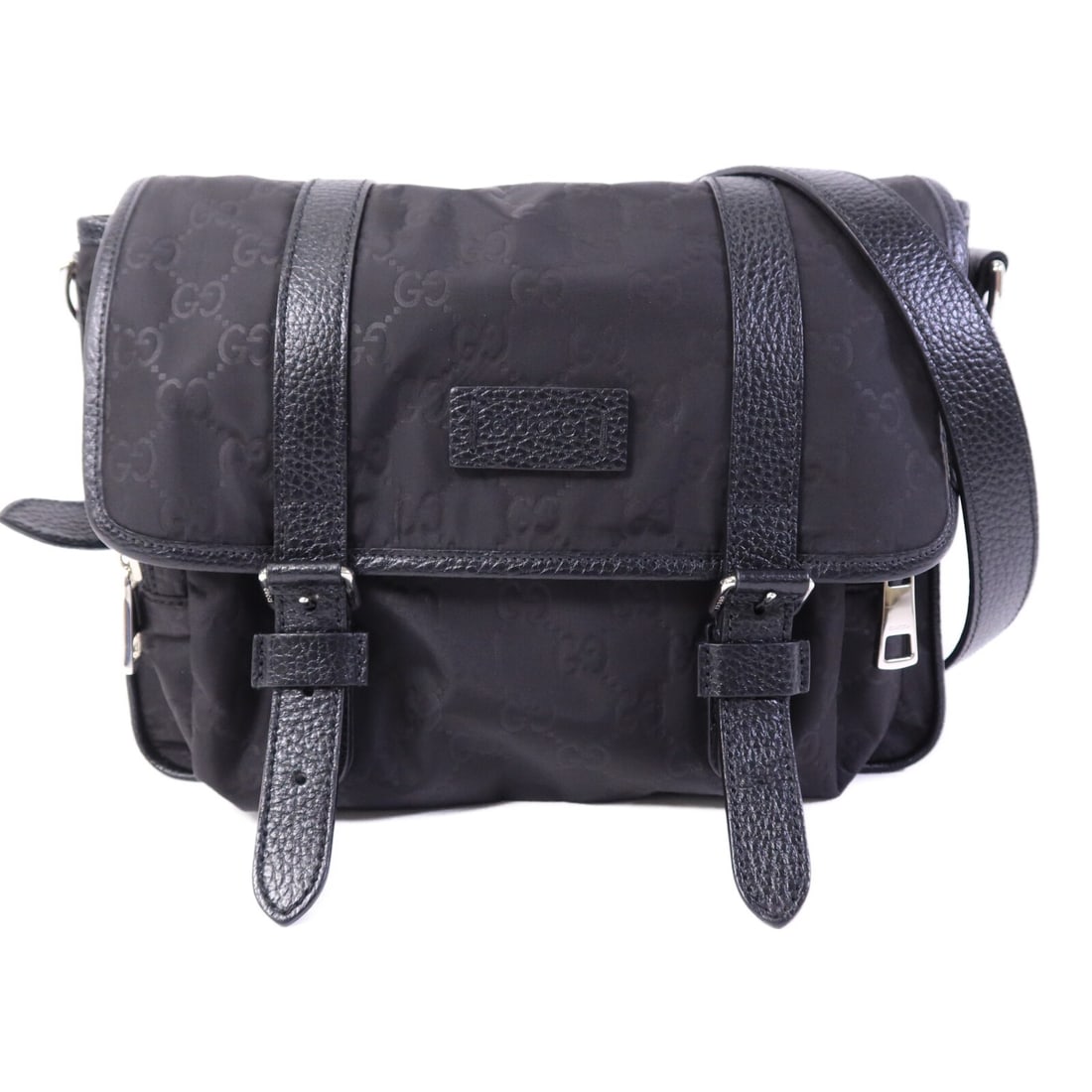 Black Nylon 510335 Shoulder Bag by Gucci with Silver Hardware: Black Nylon 510335 Shoulder Bag by Gucci with Silver Hardware This GUCCI GG shoulder bag features a sleek black nylon exterior and is equipped with silver-tone hardware. Designed for men, the bag offe