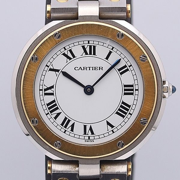 Cartier Santos Men Quartz Wristwatch Stainless Steel Yellow Gold White Dial Box: Cartier Santos Men Quartz Wristwatch Stainless Steel Yellow Gold White Dial Box This Cartier Santos men's wristwatch features a stainless steel and yellow gold construction with a white dial. Made in 