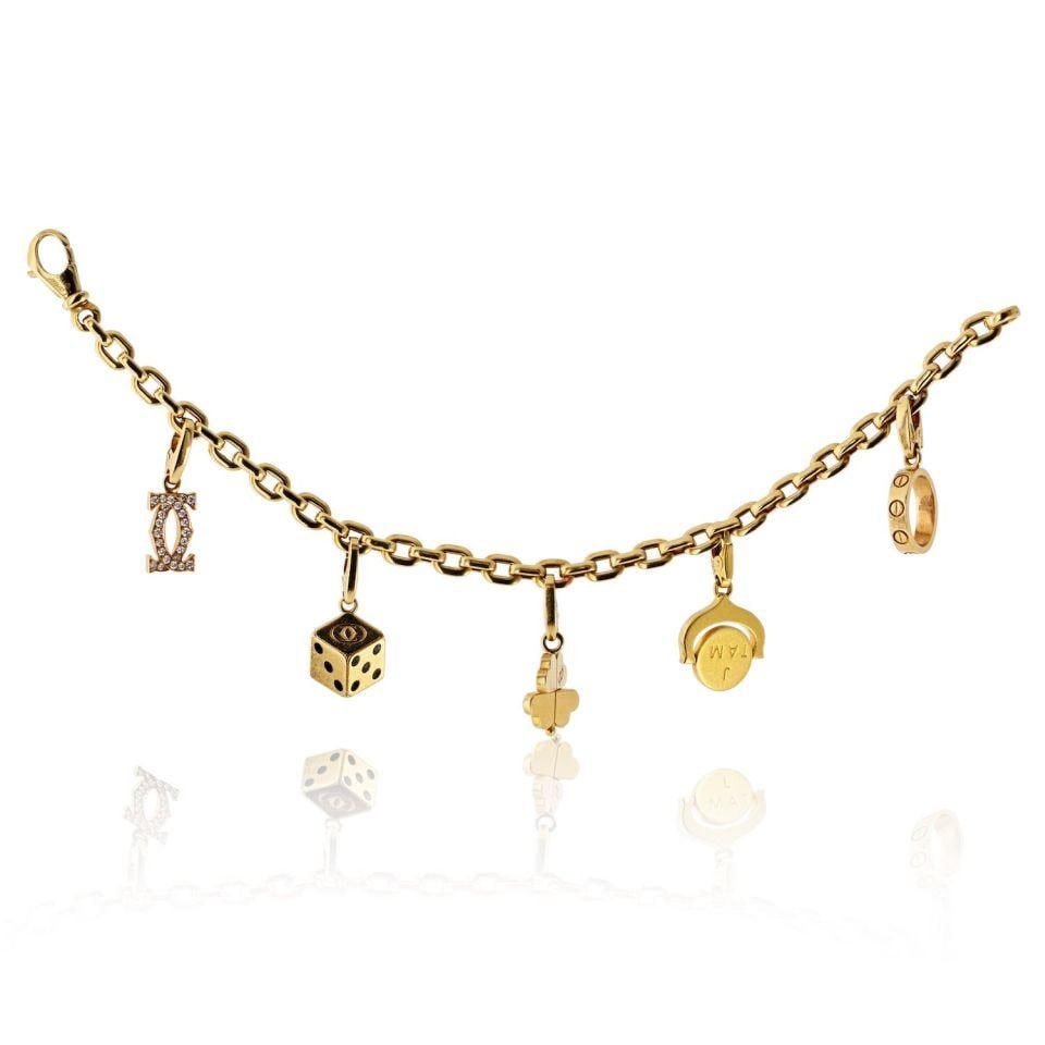 18K Yellow Gold Cartier Bracelet with Five Removable Charms 6.5 Inch: 18K Yellow Gold Cartier Bracelet with Five Removable Charms 6.5 Inch This Cartier bracelet is crafted from solid 18K yellow gold and features five removable charms, each with distinctive motifs: a dia