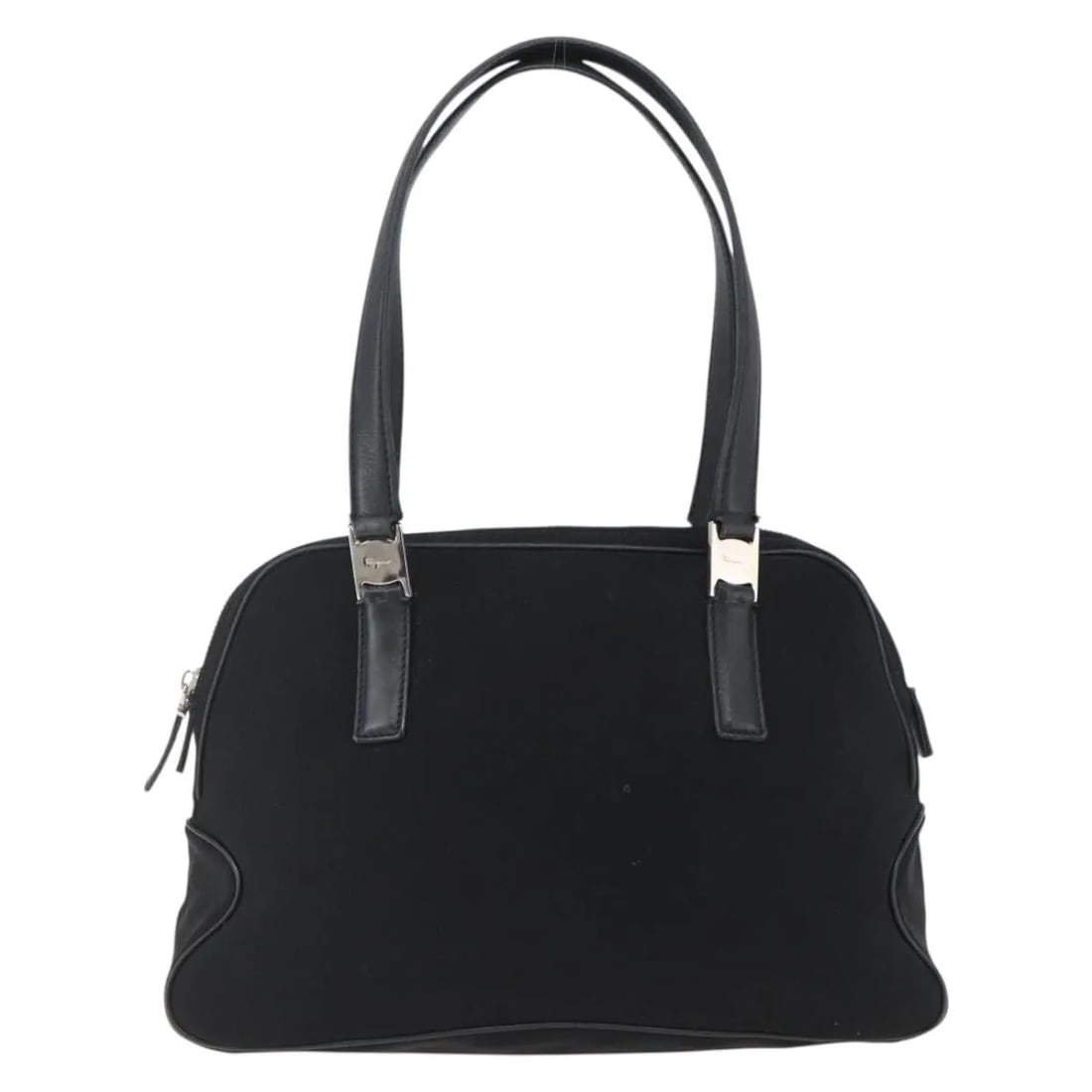 Black Nylon Handbag Salvatore Ferragamo Vintage Italy: Black Nylon Handbag Salvatore Ferragamo Vintage Italy This vintage Salvatore Ferragamo handbag for women is crafted from black nylon with leather accents. It features metal fittings and a structured d