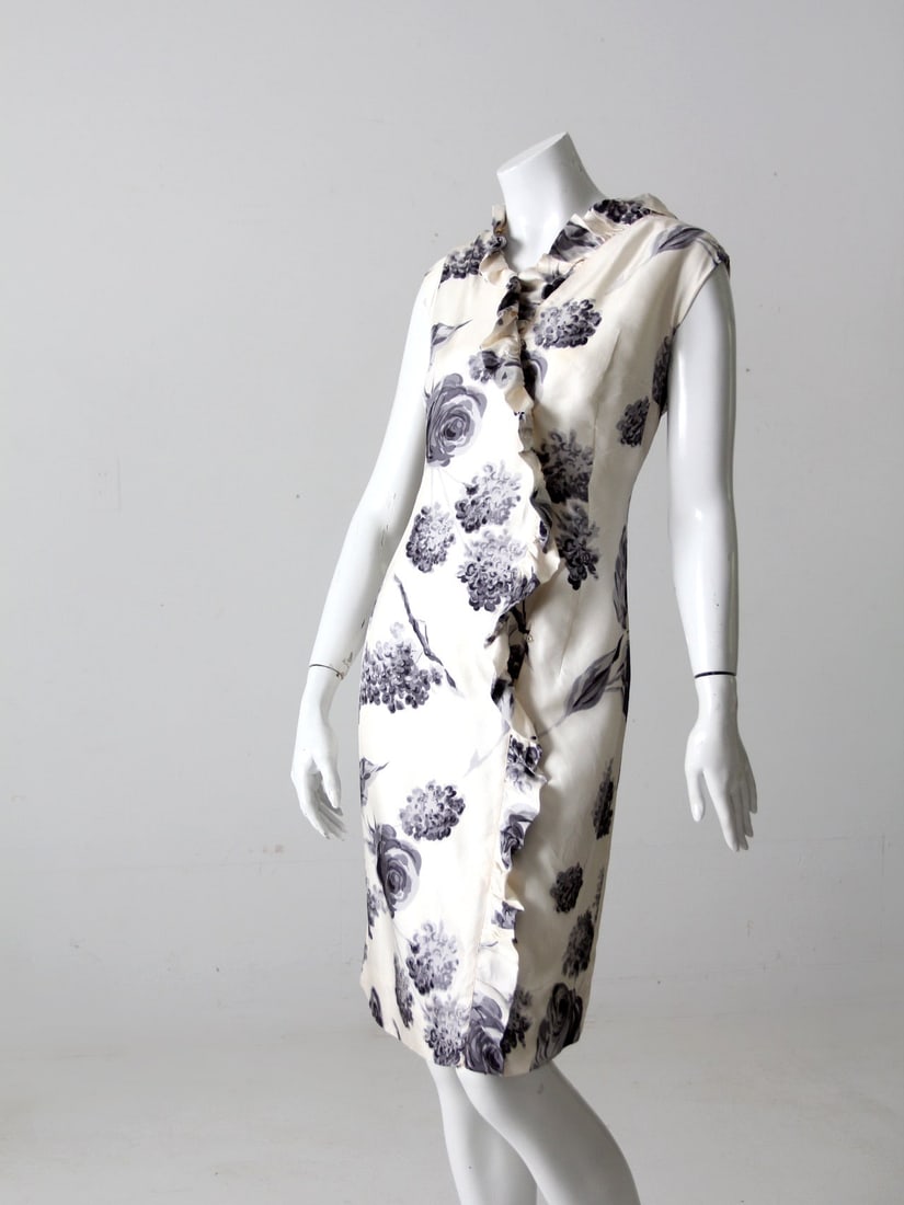 1960s Daniela Cream Silk Wrap Dress With Gray Blue Floral Print: 1960s Daniela Cream Silk Wrap Dress With Gray Blue Floral Print This vintage Italian silk dress from the 1960s by Daniela showcases timeless elegance with its creamy-white silk fabric and gray-blue fl