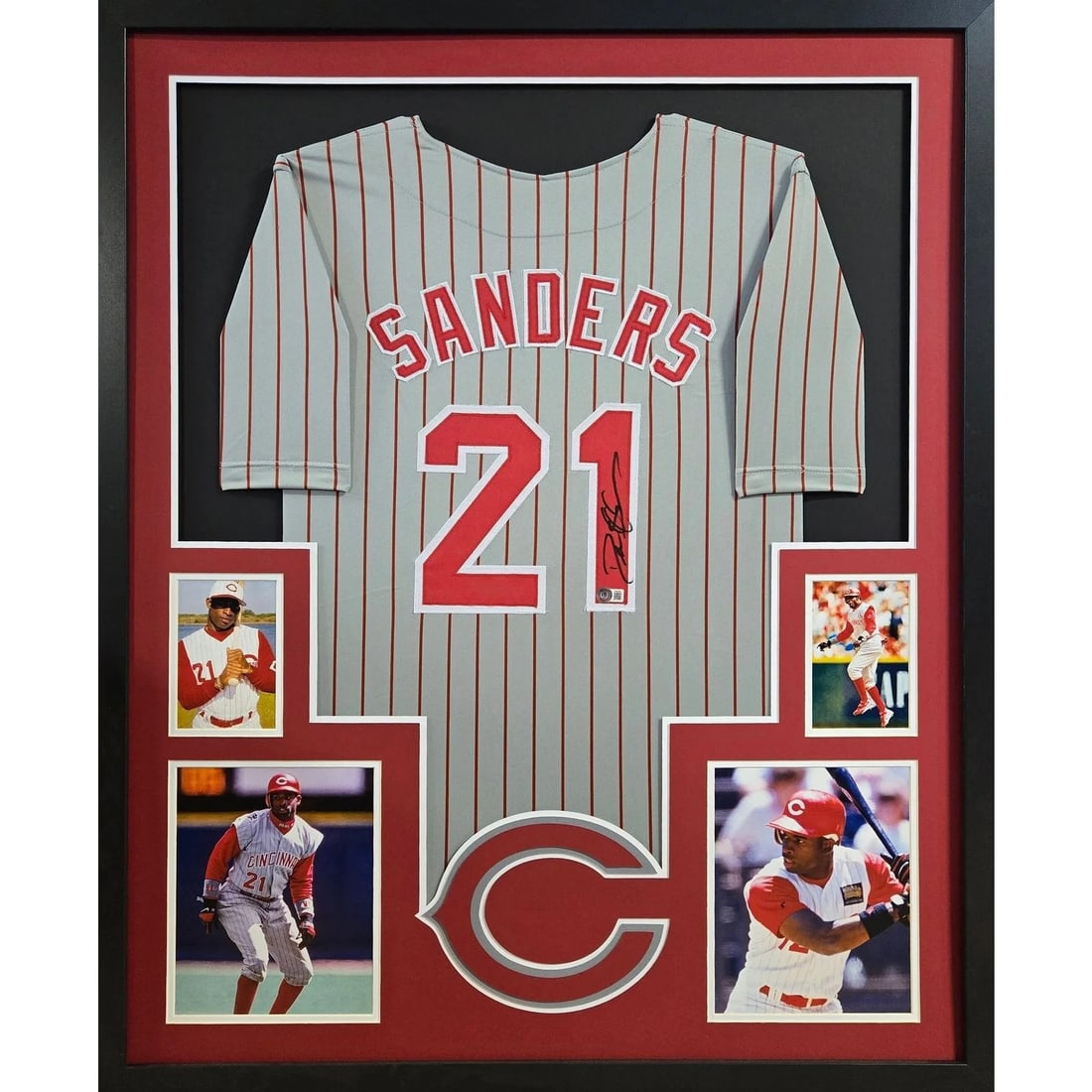 Beckett Authenticated Deion Sanders Framed Cincinnati Reds Jersey: Beckett Authenticated Deion Sanders Framed Cincinnati Reds Jersey This is a framed Cincinnati Reds jersey autographed by Deion Sanders. The jersey is professionally framed with attention to detail and