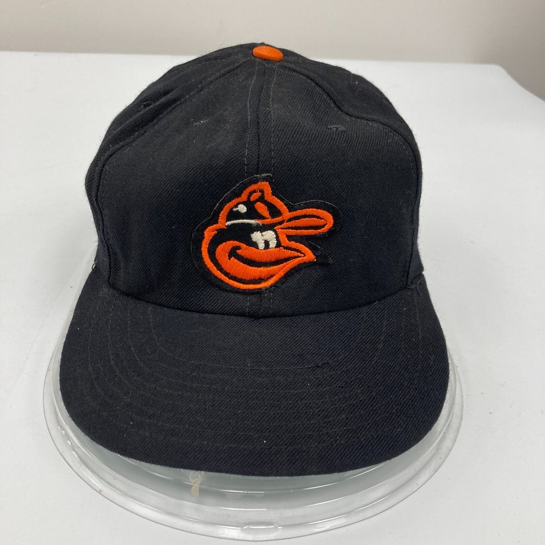 1960s Baltimore Orioles Game-Issued Wilson Baseball Cap: 1960s Baltimore Orioles Game-Issued Wilson Baseball Cap This vintage 1960's Baltimore Orioles game-issued Wilson baseball cap is a unique piece of baseball memorabilia. Originally from the collection 