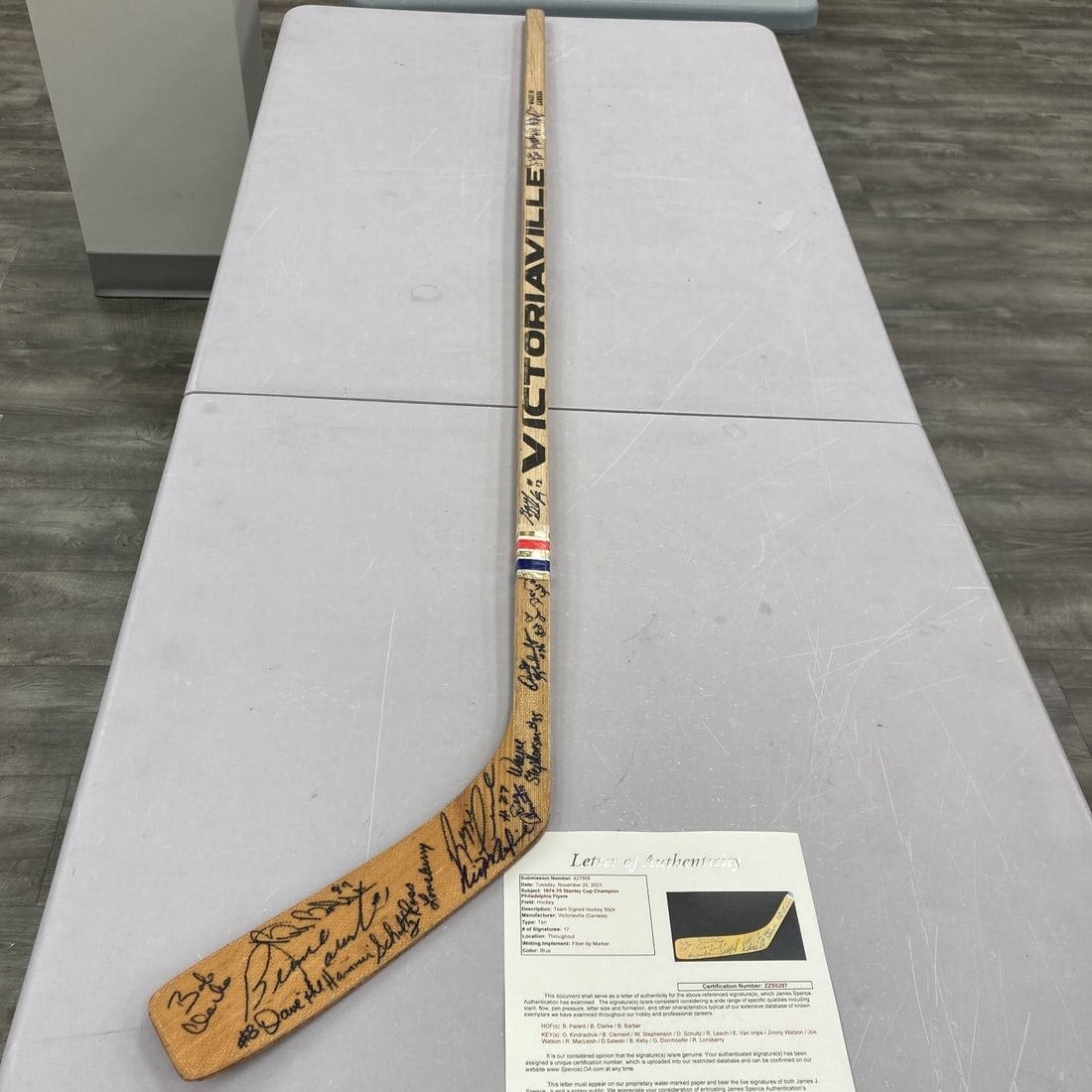 1974-75 Philadelphia Flyers Team Signed Hockey Stick JSA COA: 1974-75 Philadelphia Flyers Team Signed Hockey Stick JSA COA Celebrate the legacy of the 1974-75 Philadelphia Flyers with this authentic team-signed hockey stick. This Victoriaville 4525 Wayne Cashman