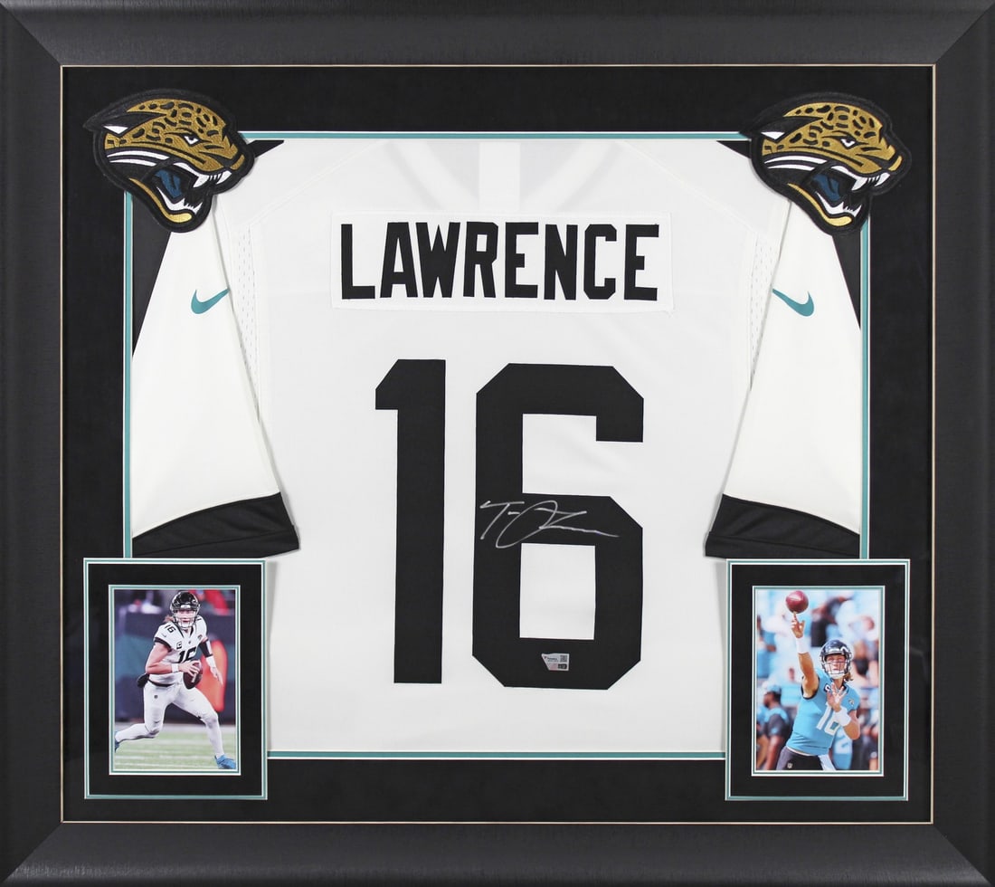 Trevor Lawrence Signed Jaguars White Nike Limited Framed Jersey: Trevor Lawrence Signed Jaguars White Nike Limited Framed Jersey Celebrate your passion for football with this original, autographed white Nike limited framed jersey of Trevor Lawrence, the star quarte