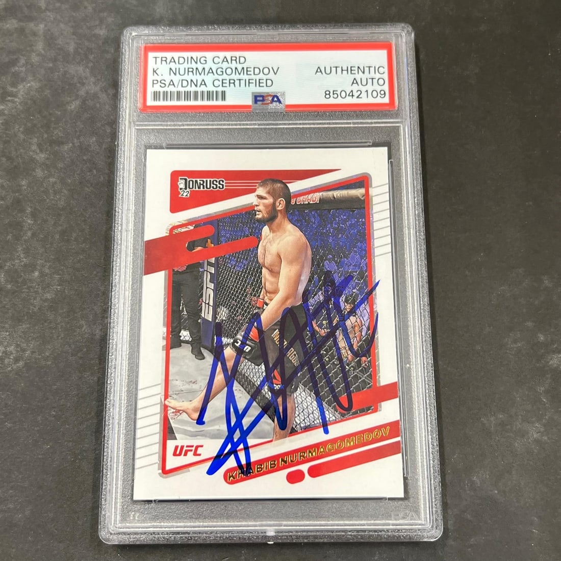 2022 Panini Donruss Khabib Nurmagomedov Signed Card PSA Authenticated: 2022 Panini Donruss Khabib Nurmagomedov Signed Card PSA Authenticated This is a 2022 Panini Donruss #4 trading card featuring the renowned mixed martial artist Khabib Nurmagomedov. The card is part of