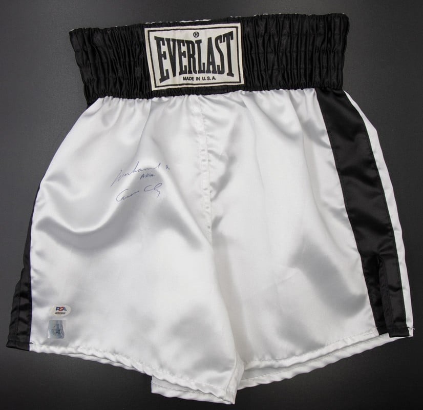 Everlast boxing shorts signed by Muhammad Ali Cassius Clay PSA DNA: Everlast boxing shorts signed by Muhammad Ali Cassius Clay PSA DNA Pre-owned Everlast boxing trunks signed by Muhammad Ali, also inscribed with his birth name, Cassius Clay, in blue ballpoint pen. The