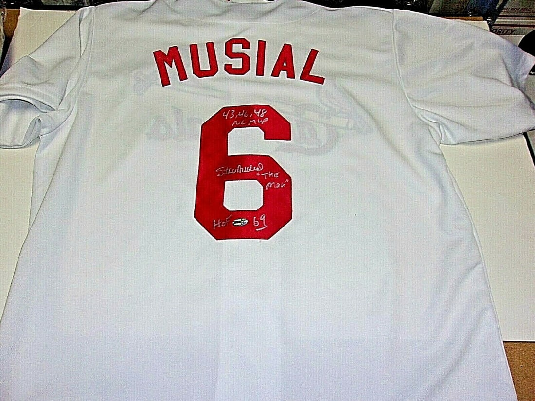 Stan Musial Autographed Majestic Cardinals Jersey with COA: Stan Musial Autographed Majestic Cardinals Jersey with COA This is an official licensed Majestic jersey signed by Stan Musial, legendary Hall of Fame baseball player inducted in 1969. The jersey comes