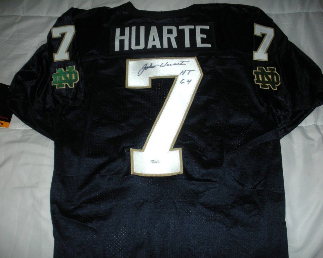 Signed Wilson Notre Dame Irish Jersey John Huarte JSA COA: Signed Wilson Notre Dame Irish Jersey John Huarte JSA COA This official licensed Wilson jersey features the signature of John Huarte, a notable player from the Notre Dame Irish football team. The jers