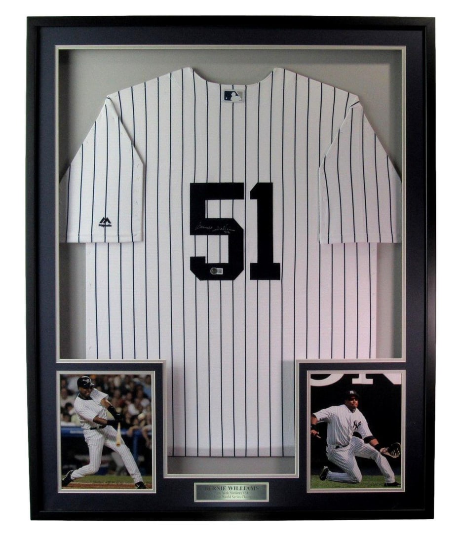 Framed Bernie Williams Yankees autographed jersey Beckett 33 in x 42 in: Framed Bernie Williams Yankees autographed jersey Beckett 33 in x 42 in This framed display features a Bernie Williams autographed New York Yankees jersey, accompanied by photos. The jersey has been a