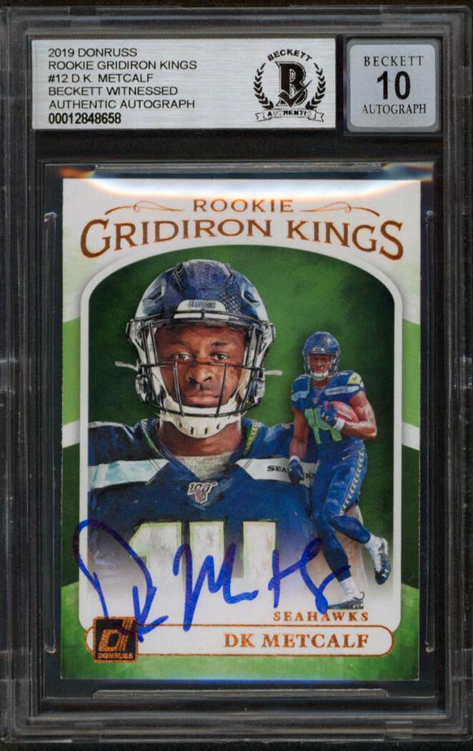 D.K. Metcalf Signed 2019 Donruss Rookie Gridiron Kings #12 Card Gem Mint 10: D.K. Metcalf Signed 2019 Donruss Rookie Gridiron Kings #12 Card Gem Mint 10 This is a 2019 Donruss Rookie Gridiron Kings #12 card featuring D.K. Metcalf of the Seattle Seahawks. The card is autographe