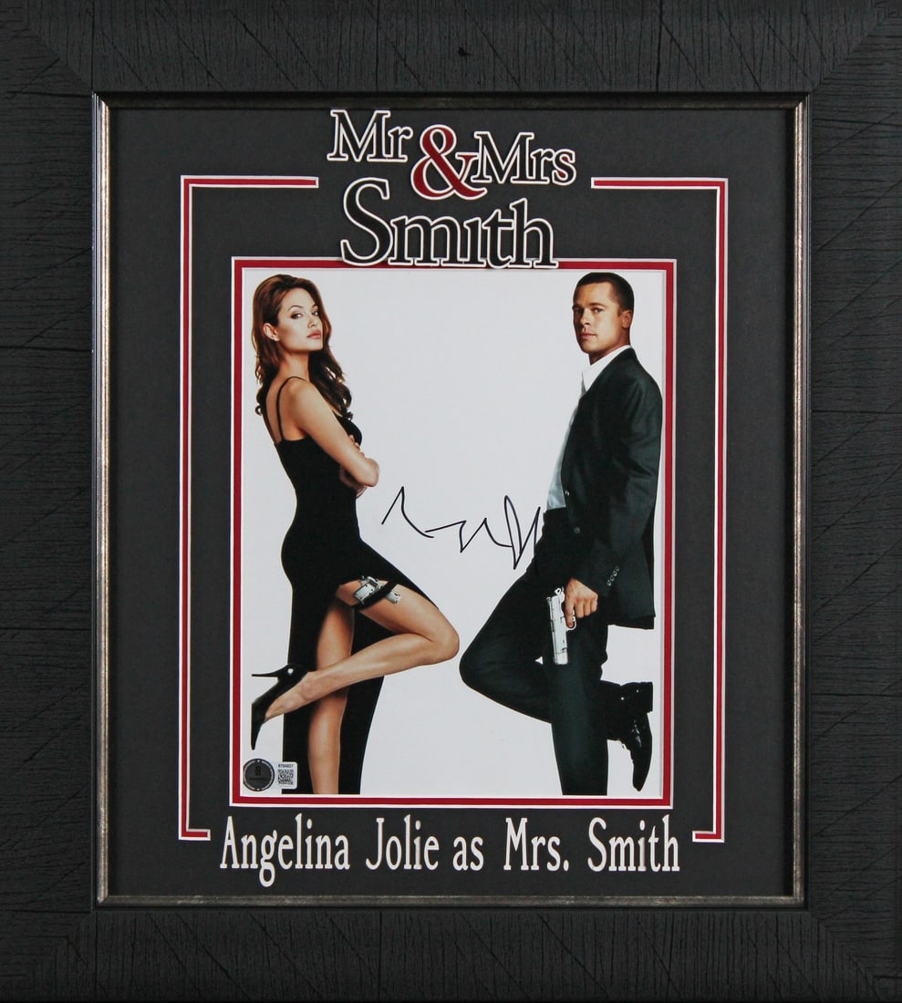 Framed 8x10 Photograph Signed by Angelina Jolie Beckett Authenticated: Framed 8x10 Photograph Signed by Angelina Jolie Beckett Authenticated This is an autographed and professionally framed 8x10 photograph featuring Angelina Jolie from the film Mr. & Mrs. Smith. The phot