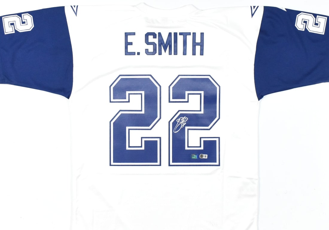 Dallas Cowboys Emmitt Smith signed Mitchell Ness Legacy jersey Beckett holo: Dallas Cowboys Emmitt Smith signed Mitchell Ness Legacy jersey Beckett holo This pre-owned Dallas Cowboys Mitchell & Ness Legacy jersey features the authentic signature of Emmitt Smith. The jersey is 