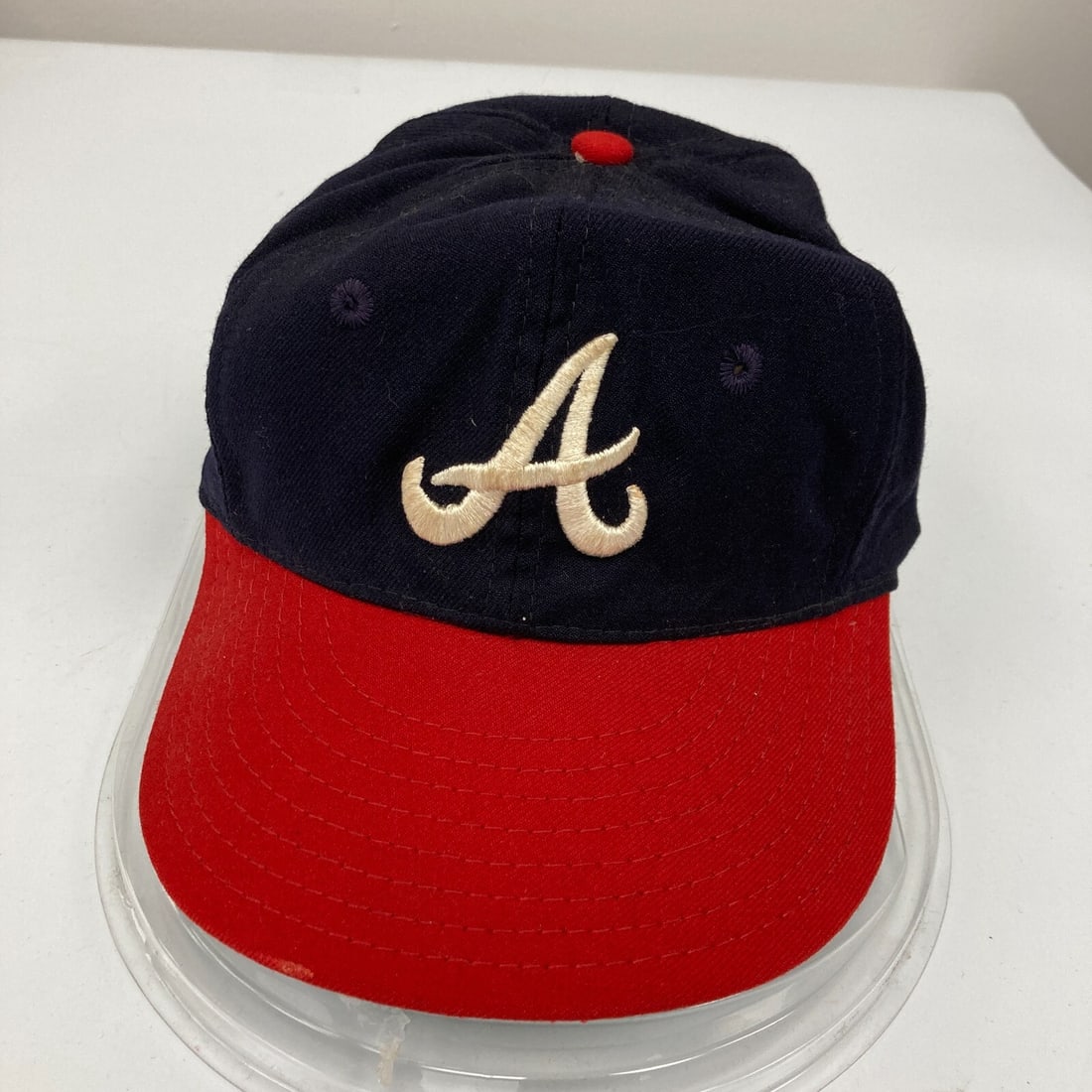 1960's Atlanta Braves Game Used Wilson Baseball Cap Hat: 1960's Atlanta Braves Game Used Wilson Baseball Cap Hat This vintage 1960's Atlanta Braves game-used Wilson baseball cap is a remarkable piece of sports memorabilia that showcases the rich history of 