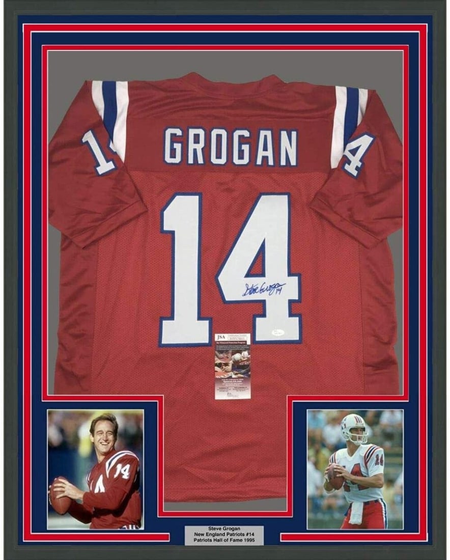 Framed Steve Grogan signed Patriots jersey with JSA COA 33x42: Framed Steve Grogan signed Patriots jersey with JSA COA 33x42 This professionally framed and matted New England Patriots red jersey is autographed by Steve Grogan and measures 33" x 42". The display i