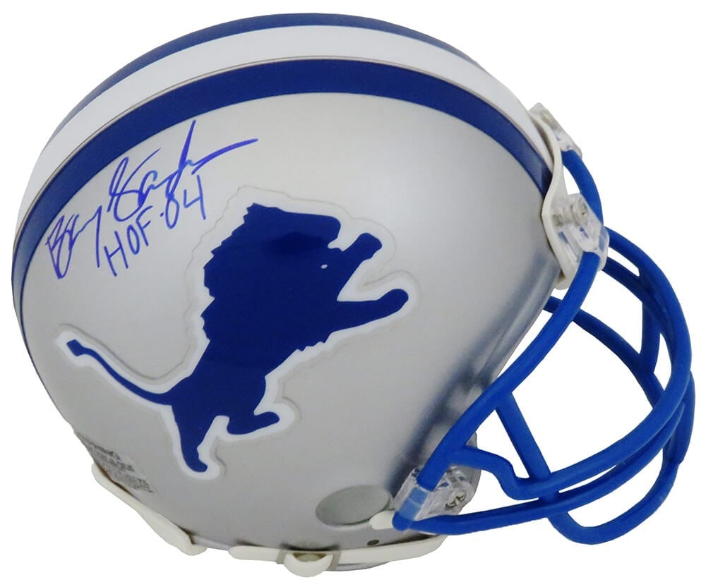 Barry Sanders Signed Lions Mini Helmet HOF 04 with COA: Barry Sanders Signed Lions Mini Helmet HOF 04 with COA Celebrate the legacy of one of football's greatest running backs with this Barry Sanders signed Detroit Lions Riddell throwback mini helmet. This