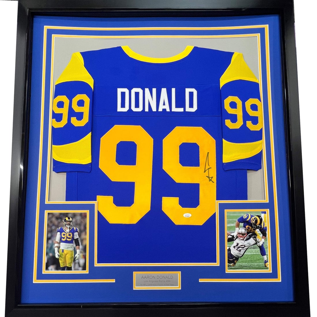 Aaron Donald signed LA Retro blue jersey framed JSA COA 33x42: Aaron Donald signed LA Retro blue jersey framed JSA COA 33x42 This professionally framed and matted Aaron Donald LA Retro Blue Jersey features an authentic autograph, verified by James Spence Authenti