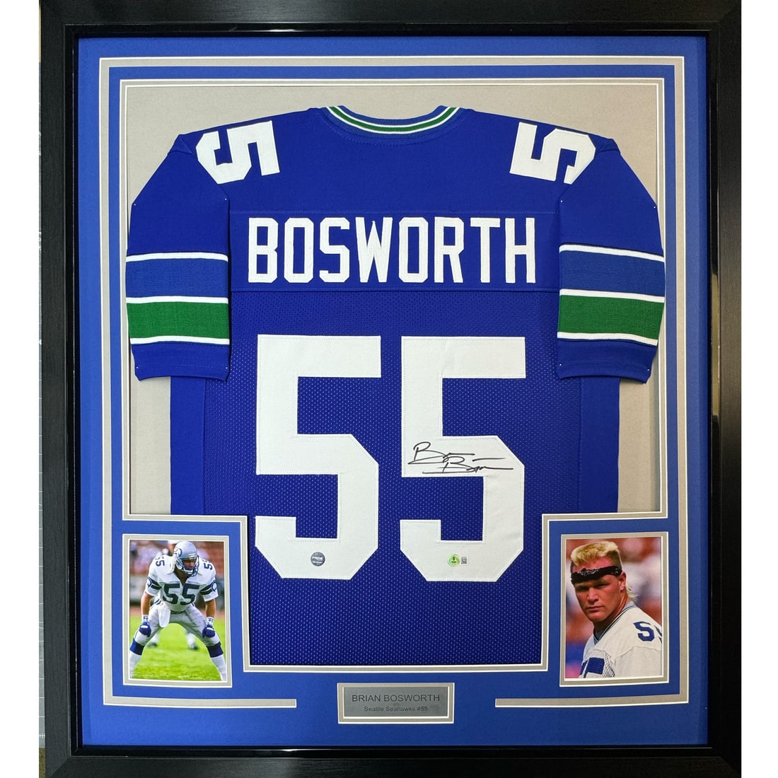 Brian Bosworth Signed Seattle Seahawks Blue Jersey Framed JSA COA 35x39: Brian Bosworth Signed Seattle Seahawks Blue Jersey Framed JSA COA 35x39 This professionally framed and matted Seattle Seahawks blue jersey features the authentic signature of Brian Bosworth. The displ