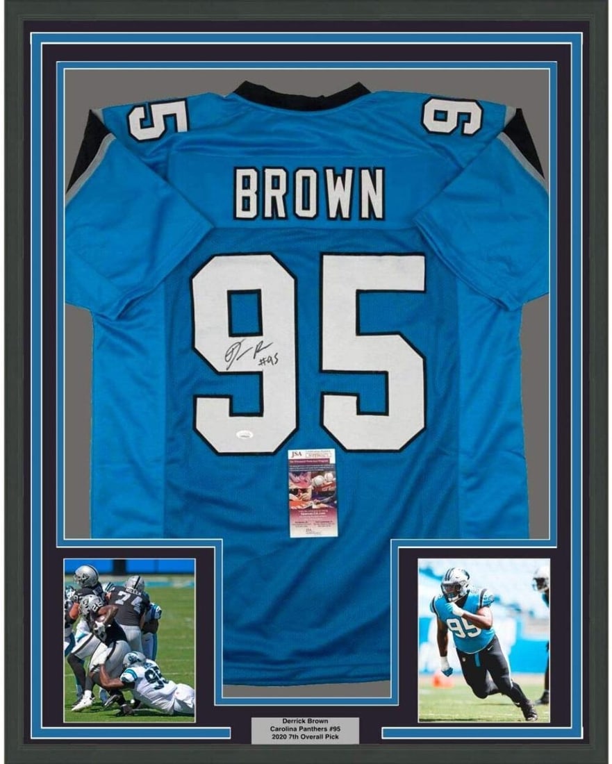 Derrick Brown Signed Carolina Panthers Jersey Framed With JSA Authentication 33x42: Derrick Brown Signed Carolina Panthers Jersey Framed With JSA Authentication 33x42 This professionally framed and matted Carolina Blue jersey features the authentic signature of Derrick Brown of the C