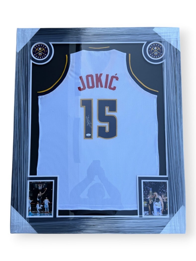 Framed Denver Nuggets White Jersey Signed by Nikola Jokic JSA Authenticated: Framed Denver Nuggets White Jersey Signed by Nikola Jokic JSA Authenticated This framed white Denver Nuggets jersey is autographed by Nikola Jokic and includes authentication from James Spence Authent