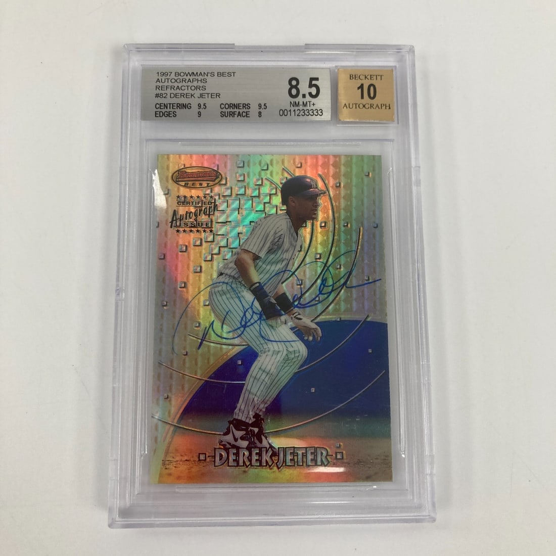 Derek Jeter 1997 Bowman's Best Refractor Signed Card BGS 8.5 JSA Auto 10: Derek Jeter 1997 Bowman's Best Refractor Signed Card BGS 8.5 JSA Auto 10 This is a 1997 Bowman's Best Derek Jeter Refractor sports trading card featuring an authentic autograph. The card is profession