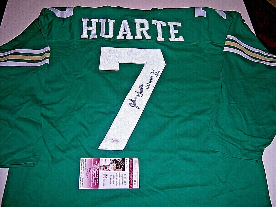 Signed Green John Huarte Notre Dame Jersey JSA COA: Signed Green John Huarte Notre Dame Jersey JSA COA This is a pre-owned green Notre Dame Fighting Irish football jersey featuring the name 'Huarte' and number '7' on the back. The jersey is personally 