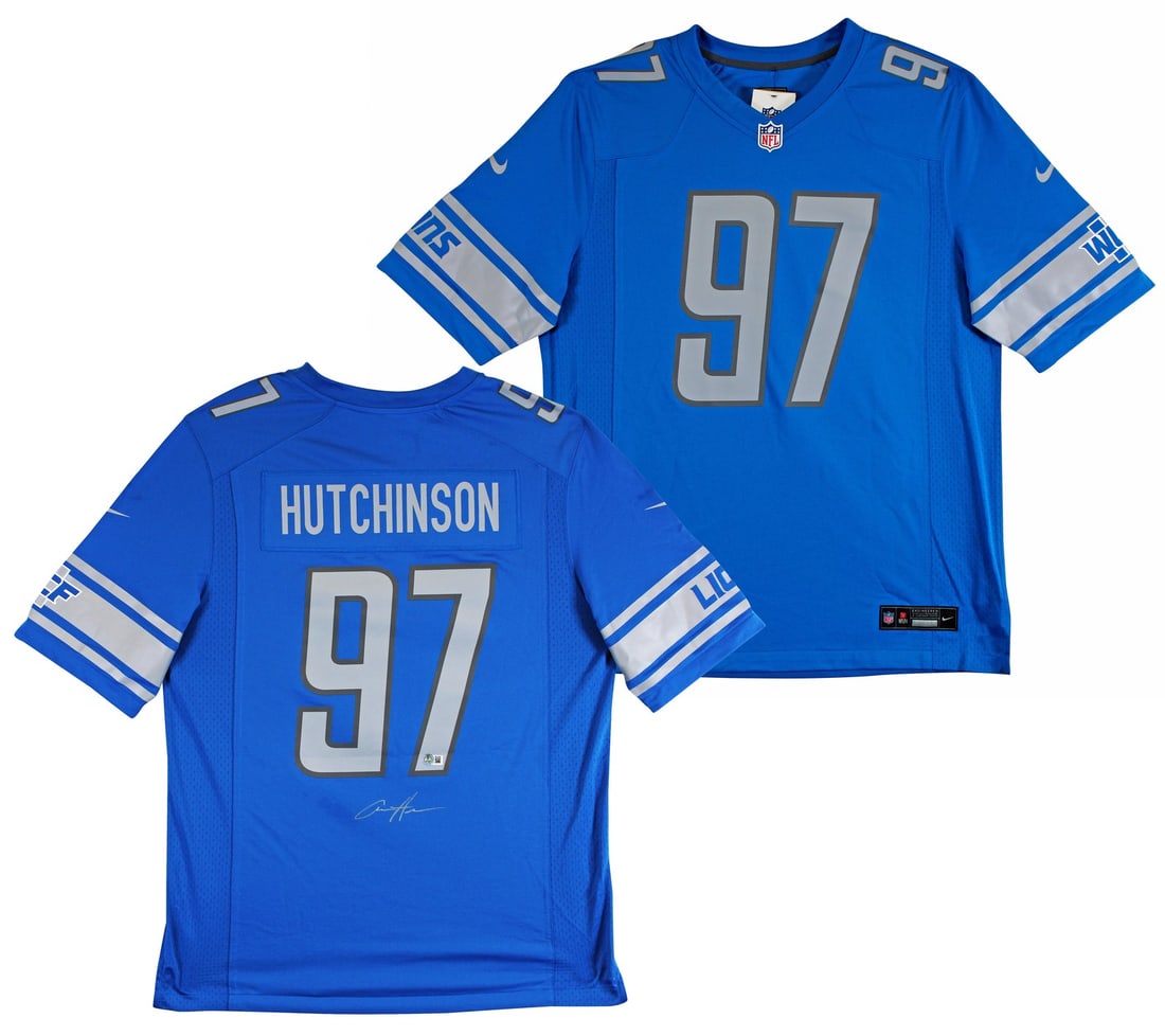 Aidan Hutchinson Signed Blue Nike Jersey with Silver Signature BAS Witnessed: Aidan Hutchinson Signed Blue Nike Jersey with Silver Signature BAS Witnessed This original blue Nike game jersey, personally signed by Aidan Hutchinson of the Detroit Lions, features a striking silver