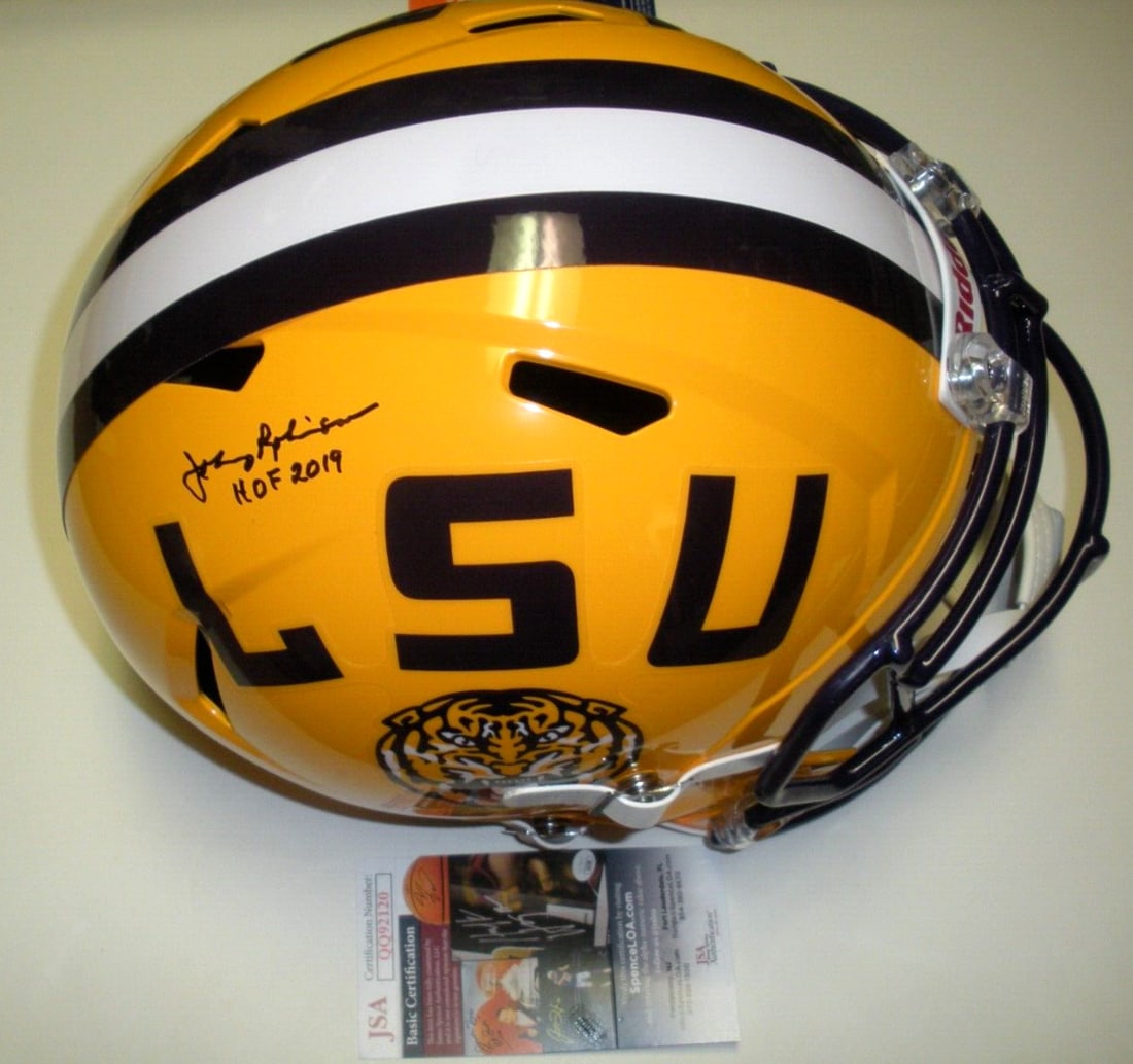 Johnny Robinson Autographed LSU Tigers Full Size Replica Helmet With JSA COA: Johnny Robinson Autographed LSU Tigers Full Size Replica Helmet With JSA COA This is a full-size replica helmet signed by Johnny Robinson, commemorating his time with the LSU Tigers. The helmet is acc