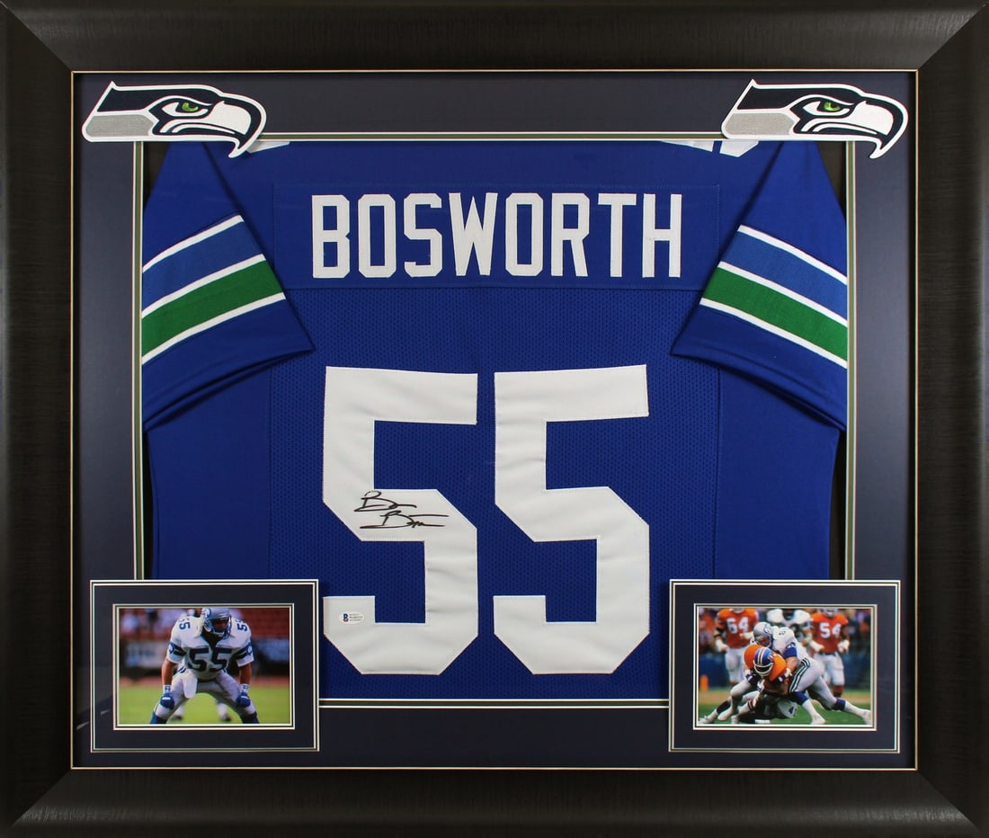 Brian Bosworth Signed Blue Pro Style Framed Jersey BAS Witnessed Seahawks: Brian Bosworth Signed Blue Pro Style Framed Jersey BAS Witnessed Seahawks This authentic blue pro style framed jersey, personally signed by Brian Bosworth of the Seattle Seahawks, showcases exceptiona