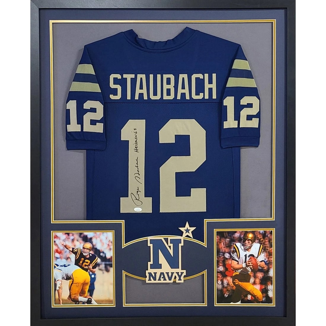 Framed Roger Staubach Navy Jersey JSA Autographed Heisman Winner: Framed Roger Staubach Navy Jersey JSA Autographed Heisman Winner This framed jersey features an authentic autograph by Roger Staubach, the celebrated Heisman Trophy winner. The jersey is professionall