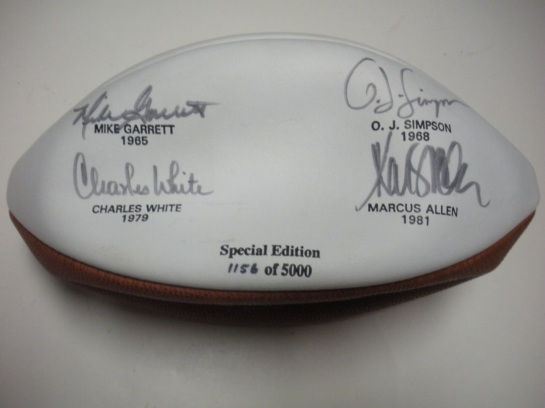 Football Signed by Simpson Allen Garrett White with COA USC Trojans: Football Signed by Simpson Allen Garrett White with COA USC Trojans This football is signed by O.J. Simpson, Marcus Allen, Mike Garrett, and Charles White, all notable Trojan players. It is an origina