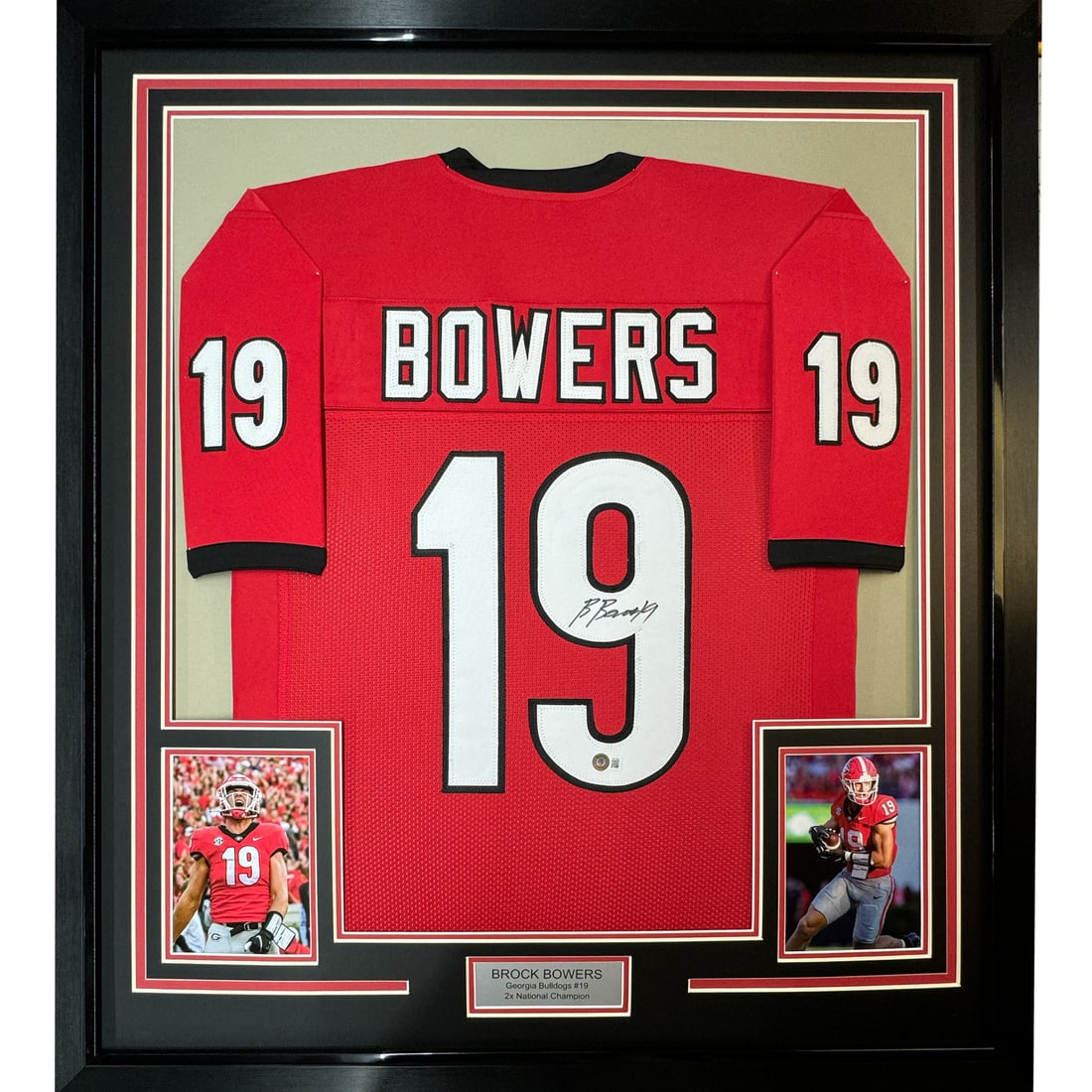 Brock Bowers framed signed Georgia red jersey Beckett BAS COA 35x39: Brock Bowers framed signed Georgia red jersey Beckett BAS COA 35x39 This professionally framed and matted display features a red Georgia Bulldogs jersey autographed by Brock Bowers. The jersey comes w