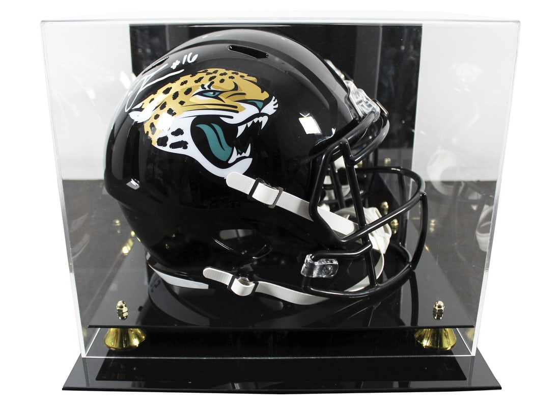 Trevor Lawrence Signed Jaguars Full Size Speed Helmet with Fanatics Hologram: Trevor Lawrence Signed Jaguars Full Size Speed Helmet with Fanatics Hologram This full-size Speed replica helmet is a must-have for fans of Trevor Lawrence and the Jacksonville Jaguars. It features an