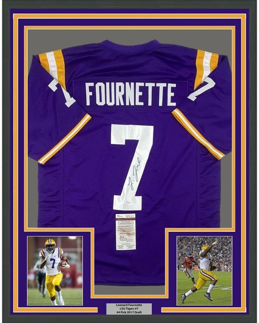 Framed Leonard Fournette LSU Purple Signed Jersey JSA COA 33x42: Framed Leonard Fournette LSU Purple Signed Jersey JSA COA 33x42 This professionally framed and matted LSU Tigers purple jersey features the autograph of Leonard Fournette. The display includes two 8x1