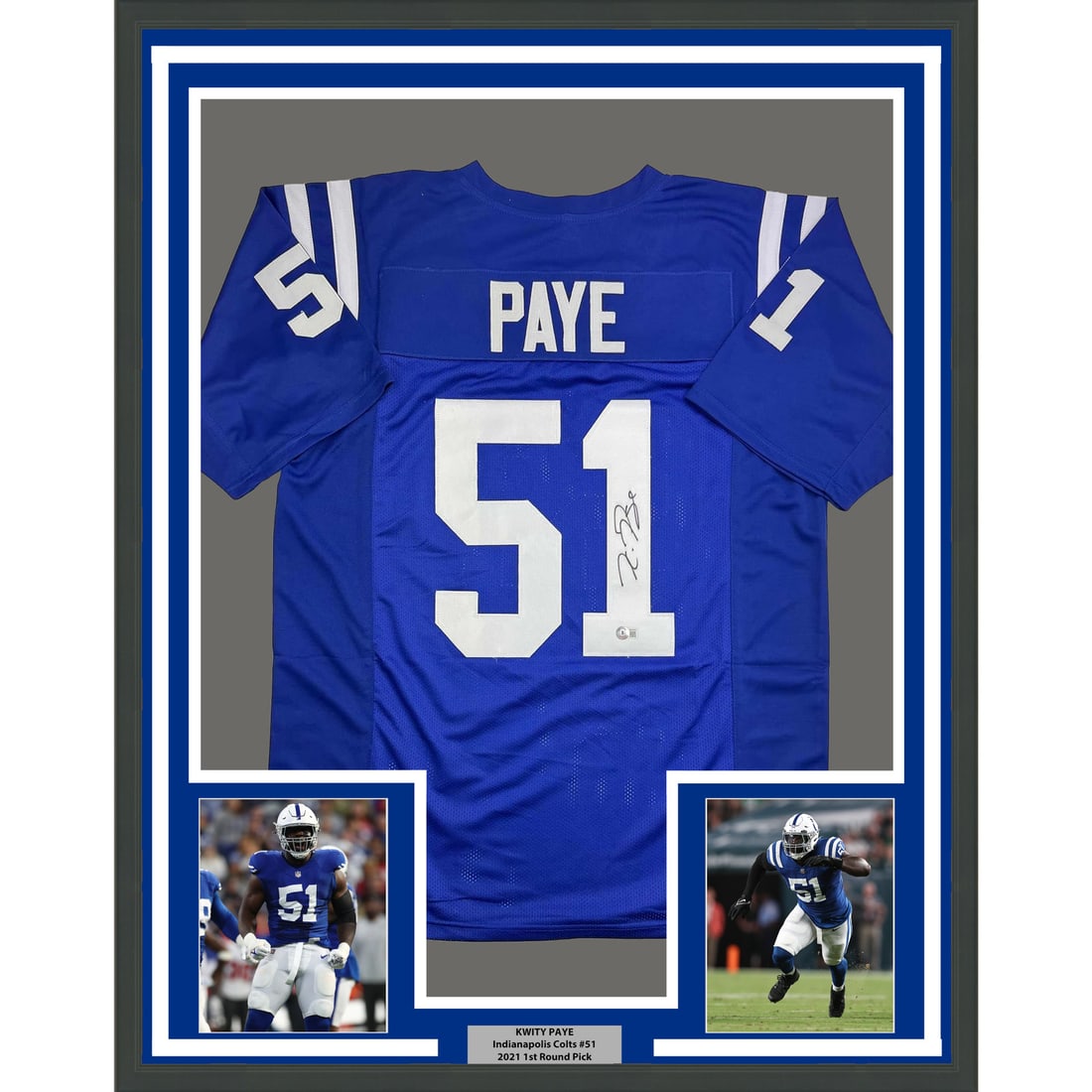 Kwity Paye Signed Indianapolis Colts Jersey in 35x39 Frame Beckett Certified: Kwity Paye Signed Indianapolis Colts Jersey in 35x39 Frame Beckett Certified This professionally framed and matted display features a blue Indianapolis Colts jersey autographed by Kwity Paye. The fram