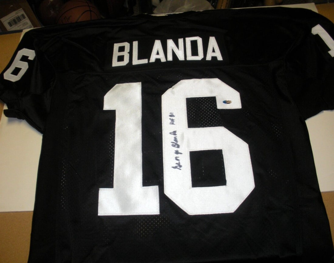 George Blanda Signed Oakland Raiders Champion Jersey with COA: George Blanda Signed Oakland Raiders Champion Jersey with COA This officially licensed Champion jersey features the signature of George Blanda, a legendary player for the Oakland Raiders. It comes wit