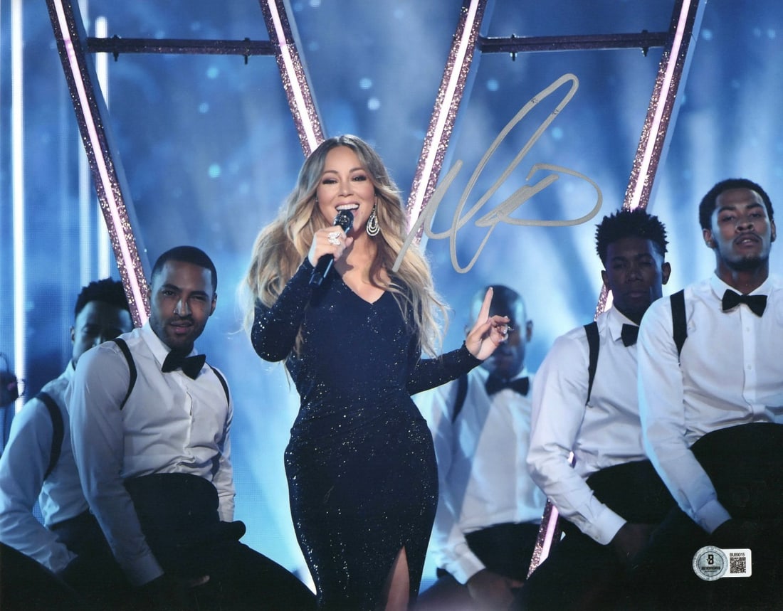 Mariah Carey Signed 11x14 Photo Beckett Authenticated: Mariah Carey Signed 11x14 Photo Beckett Authenticated This stunning 11x14 photograph features Mariah Carey in a captivating pose while singing on stage. The photograph is an original piece, hand-signe