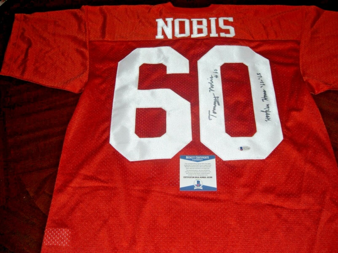 Tommy Nobis Signed Texas Longhorns Russell Jersey with Beckett COA: Tommy Nobis Signed Texas Longhorns Russell Jersey with Beckett COA This authentic Russell jersey features the iconic Texas Longhorns design, signed by Tommy Nobis, a legendary figure in NFL history. T