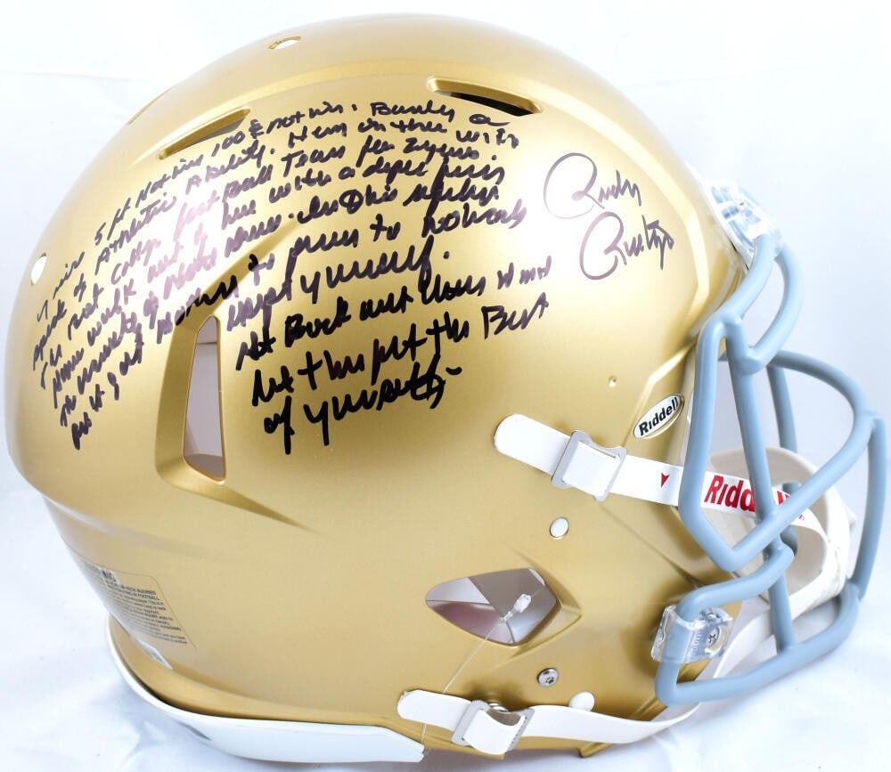 Riddell Speed Authentic Notre Dame Helmet Signed by Rudy Ruettiger Beckett: Riddell Speed Authentic Notre Dame Helmet Signed by Rudy Ruettiger Beckett This is an original Notre Dame Riddell full-size Speed football helmet signed by Rudy Ruettiger. It is described as pre-owned