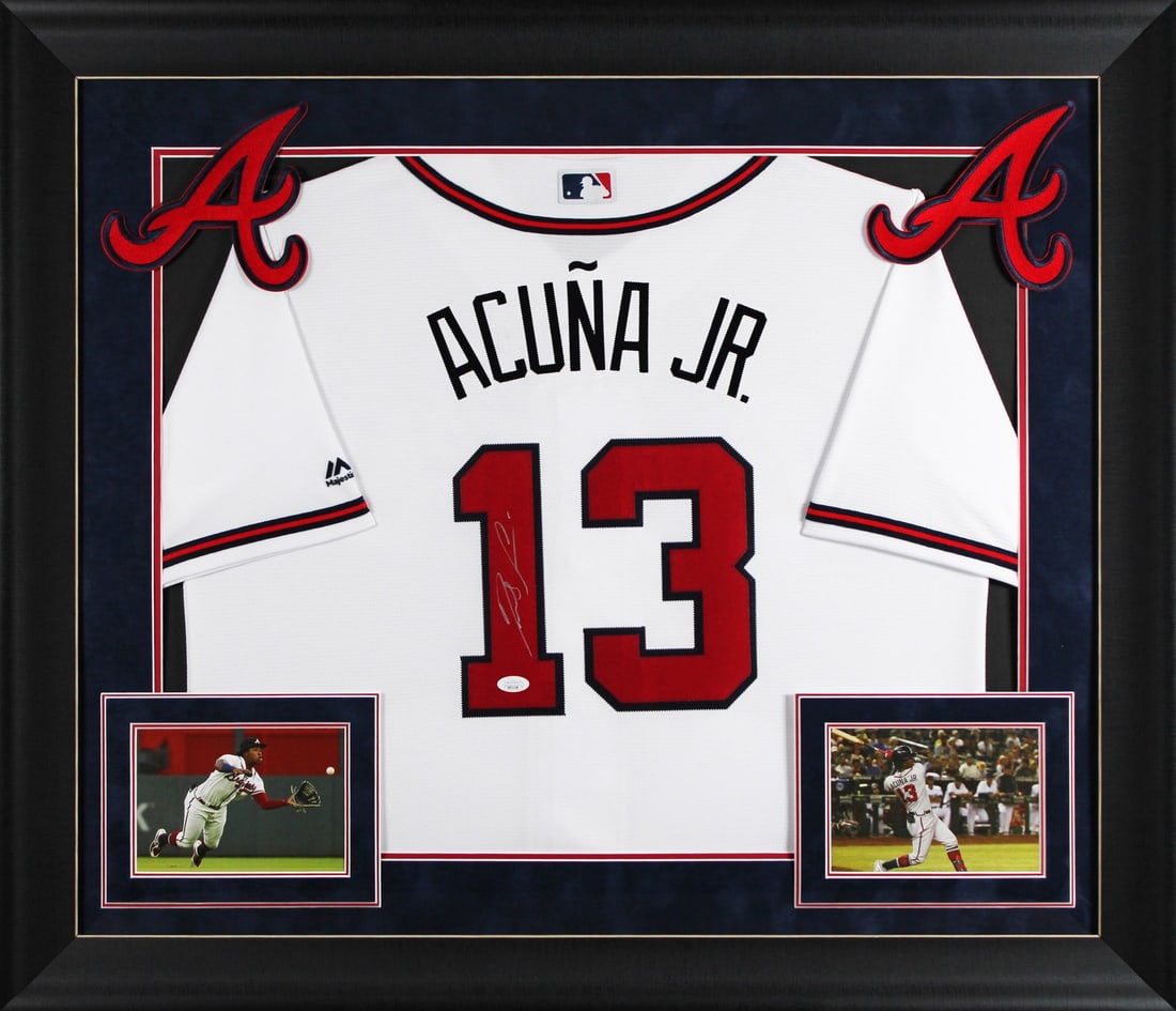 Framed Ronald Acuna Jr. Autographed Atlanta Braves White Jersey JSA Authenticated: Framed Ronald Acuna Jr. Autographed Atlanta Braves White Jersey JSA Authenticated This professionally framed white Majestic jersey features the authentic signature of Ronald Acuna Jr. from the Atlanta