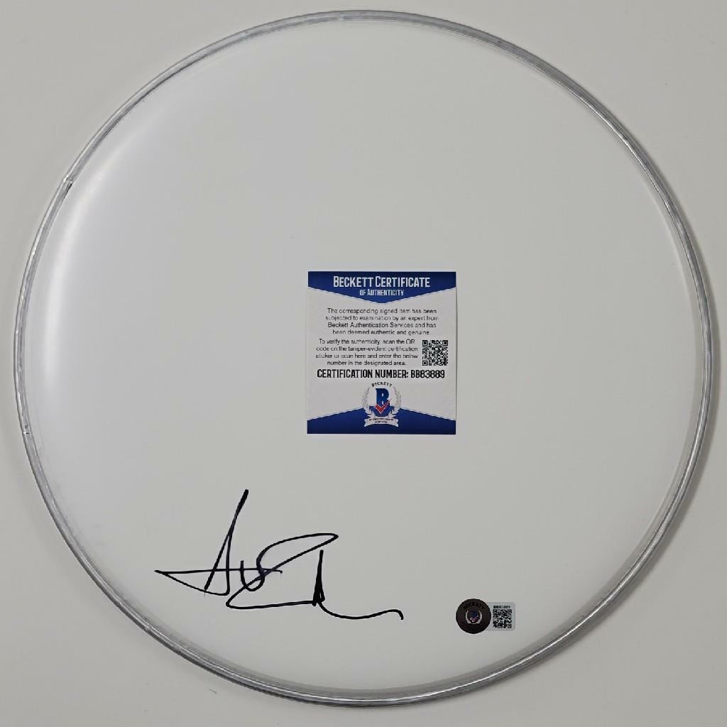 Avril Lavigne Autographed 12 Inch Drumhead With Beckett Certificate: Avril Lavigne Autographed 12 Inch Drumhead With Beckett Certificate This 12-inch drumhead has been signed by singer Avril Lavigne. The autograph is authenticated by Beckett and the item is an original