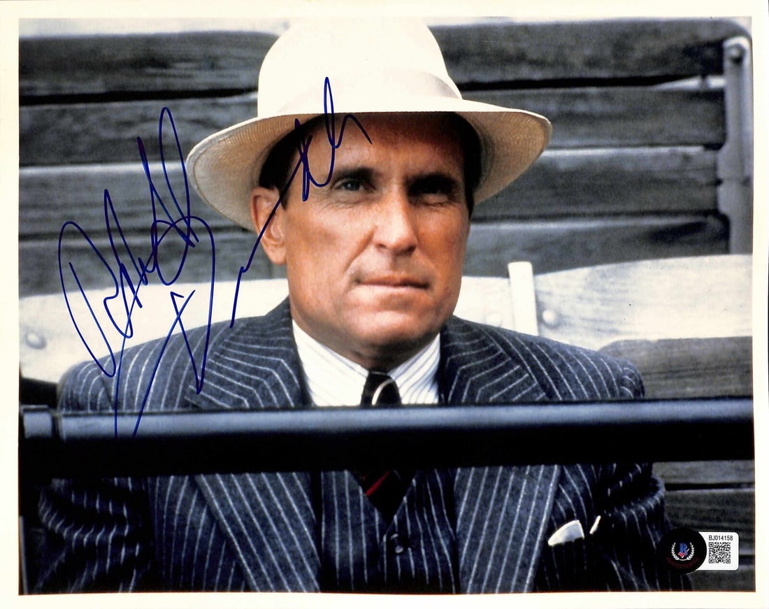 Robert Duvall Signed 8x10 Photo as Max Mercy Beckett Certified: Robert Duvall Signed 8x10 Photo as Max Mercy Beckett Certified This autographed 8x10 photograph features Robert Duvall as "Max Mercy" from the iconic film The Natural. The signature is rendered in blu