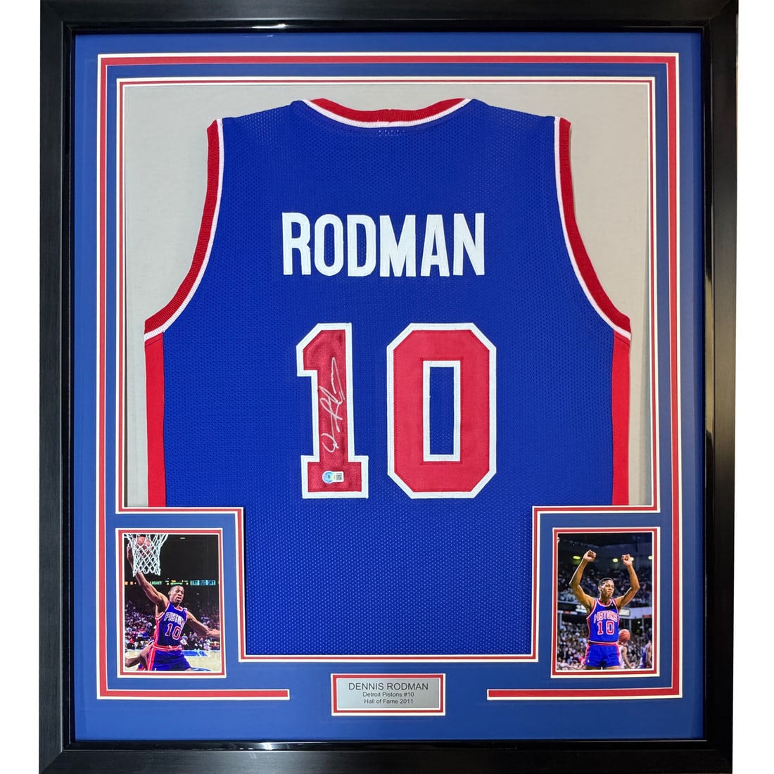 Dennis Rodman signed Detroit Pistons blue jersey framed display 35x39 JSA COA: Dennis Rodman signed Detroit Pistons blue jersey framed display 35x39 JSA COA This professionally framed display features a Detroit Pistons blue jersey autographed by Dennis Rodman. The jersey is acco