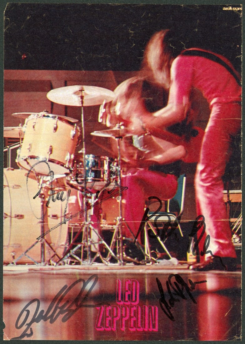 Autographed Led Zeppelin magazine page JSA COA 4 signatures: Autographed Led Zeppelin magazine page JSA COA 4 signatures This is an original 8.25 x 11.75 inch magazine page autographed by Robert Plant, Jimmy Page, John Bonham, and John Paul Jones of Led Zeppeli
